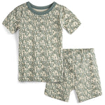 Children's pajama set with short-sleeve top and shorts featuring a green pattern on a beige background.